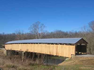 Beechfork covered bridge exterior after restoration with new siding and metal roof