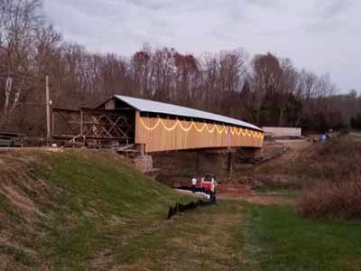 Beechfork covered bridge exterior decorated with holiday lights