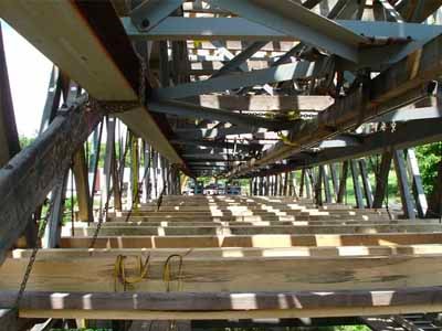 Johnson Creek bridge interior steel truss and new floor deck during restoration