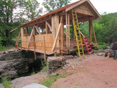 Tuscarora bridge trusses and framing spanning rocky gorge over stream