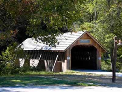 William Henry Stevens covered bridge exterior surrounded by green summer trees